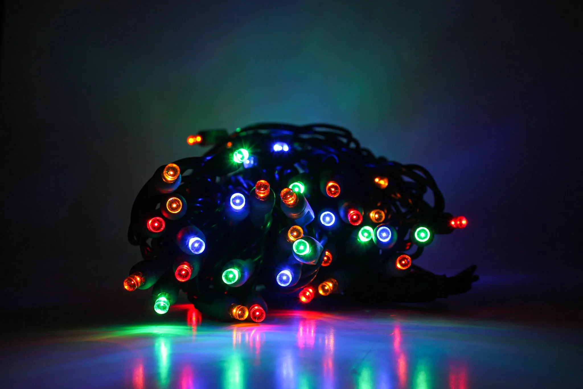 Outdoor LED Lighted Christmas Tree with Green Base and Orange and Purple Tree Lights